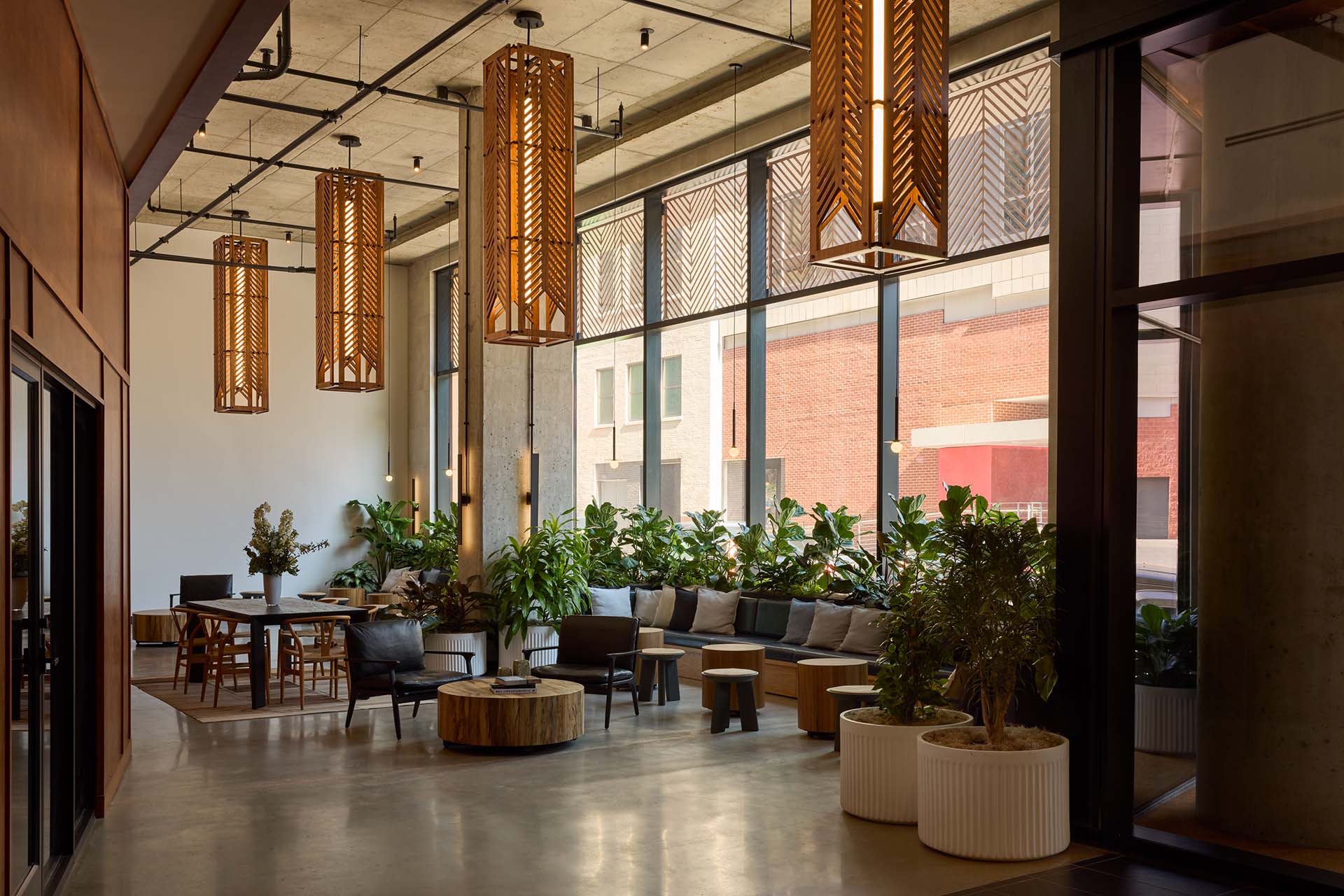 Resident lounge at Jessup House Apartments in Philadelphia, featuring wood grain flooring and modern decor.